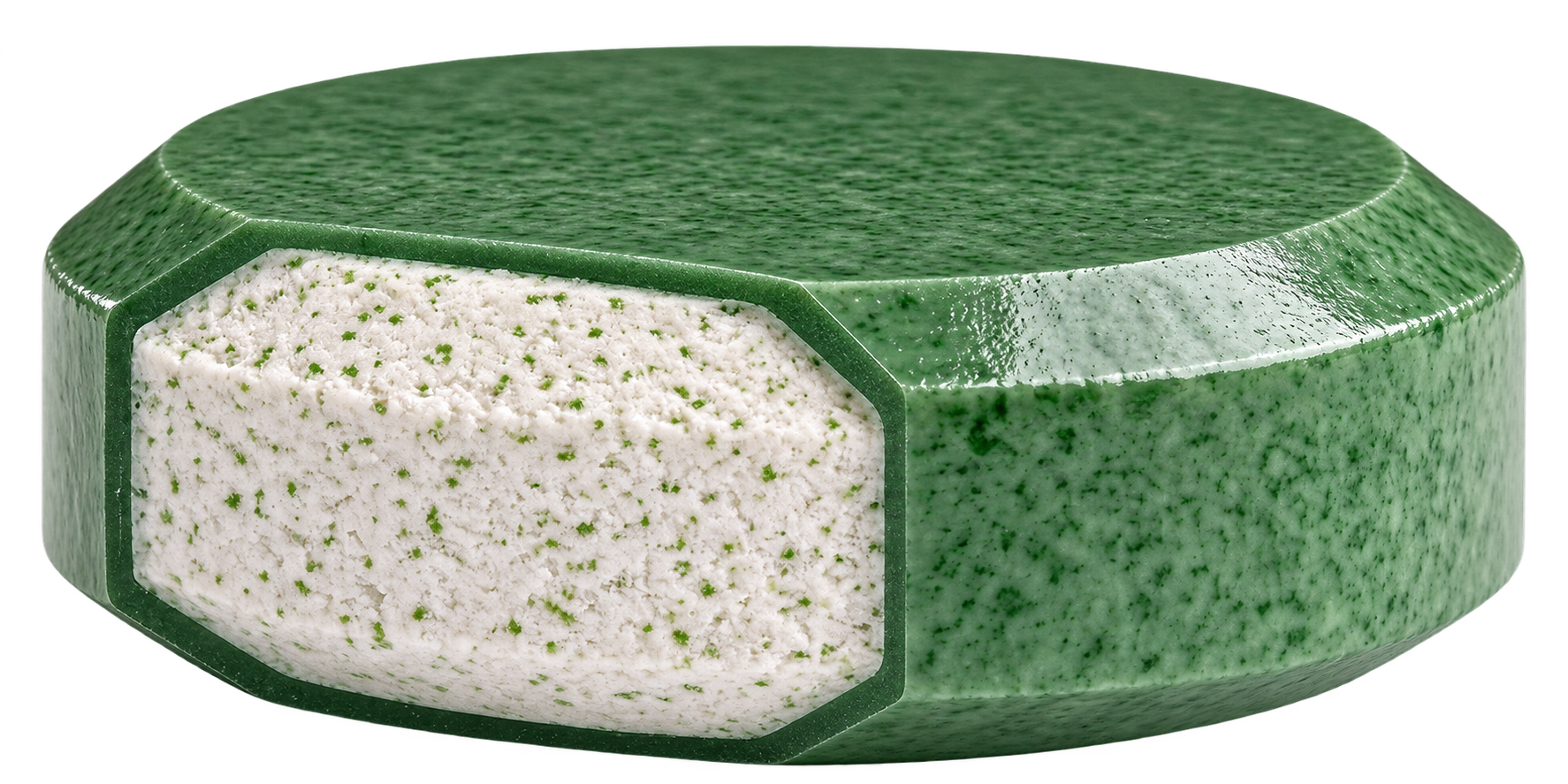 Cutaway of a green TABCOTE tablet with a beveled edge, revealing the white nutrient core inside